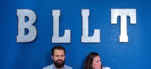 Bright Light Land Title interior sign with team